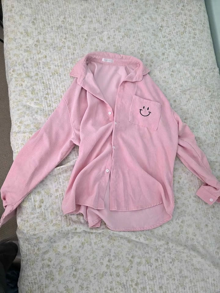Pink collared shirt with smile for men