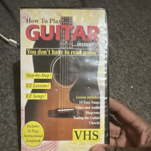 Harmonica Music Publishing How To Play Guitar...instantly VHS +1