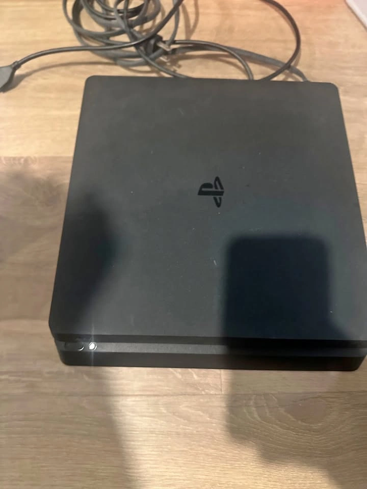 PlayStation 4, two controllers and games
