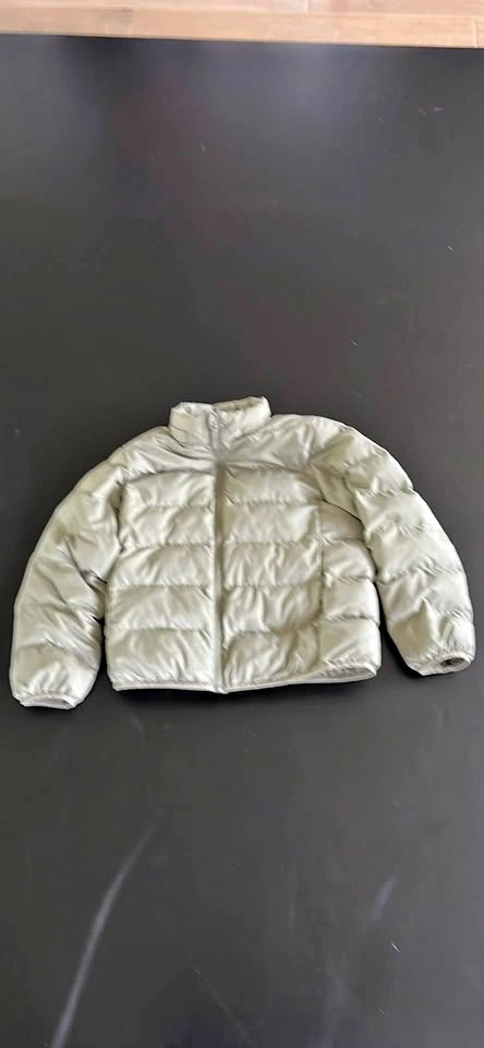 Green puffy Uniqlo jacket for kids