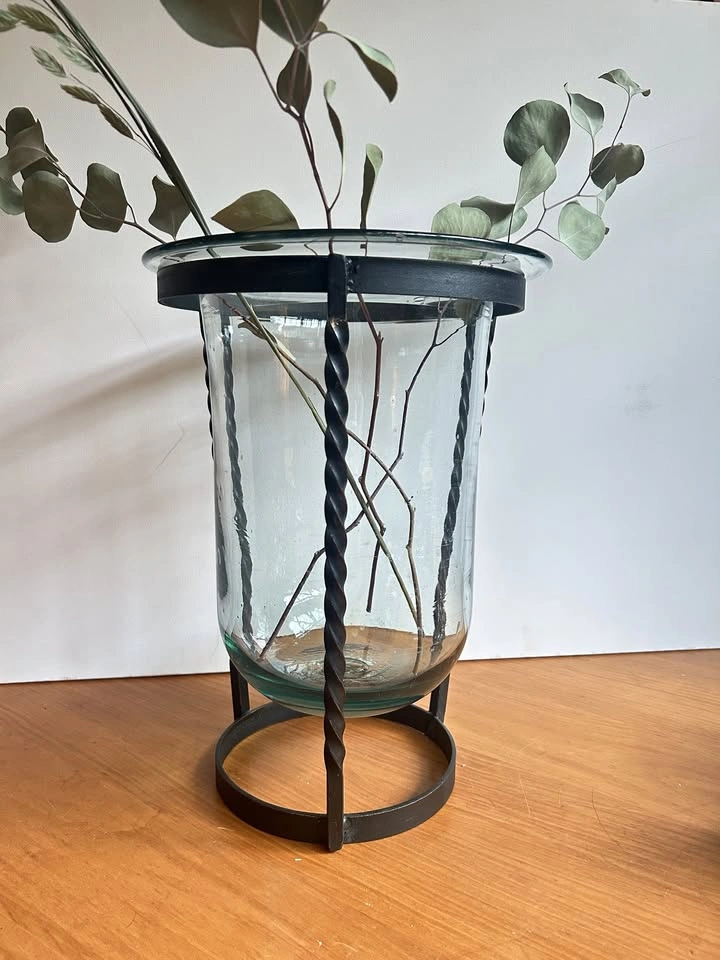 Tall hurricane glass vase with iron stand
