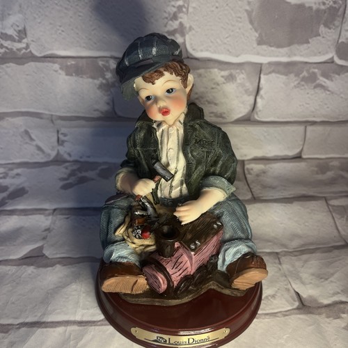 Louis Dionne Vintage Collectible Resin Figurine with Toy Train