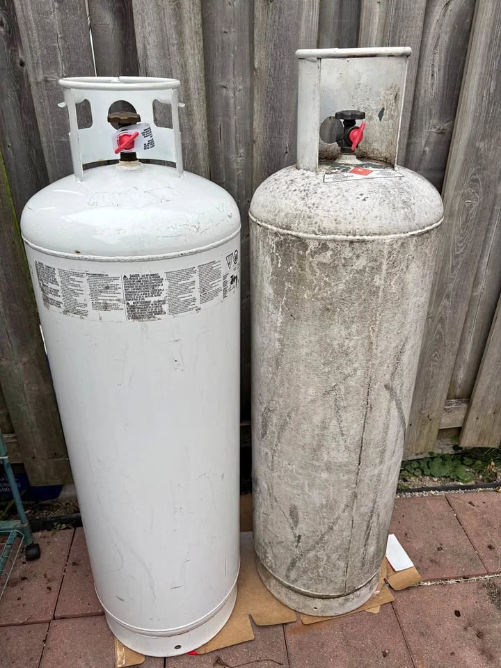 Two 100 lb Propane Tanks - empty - needs recertification