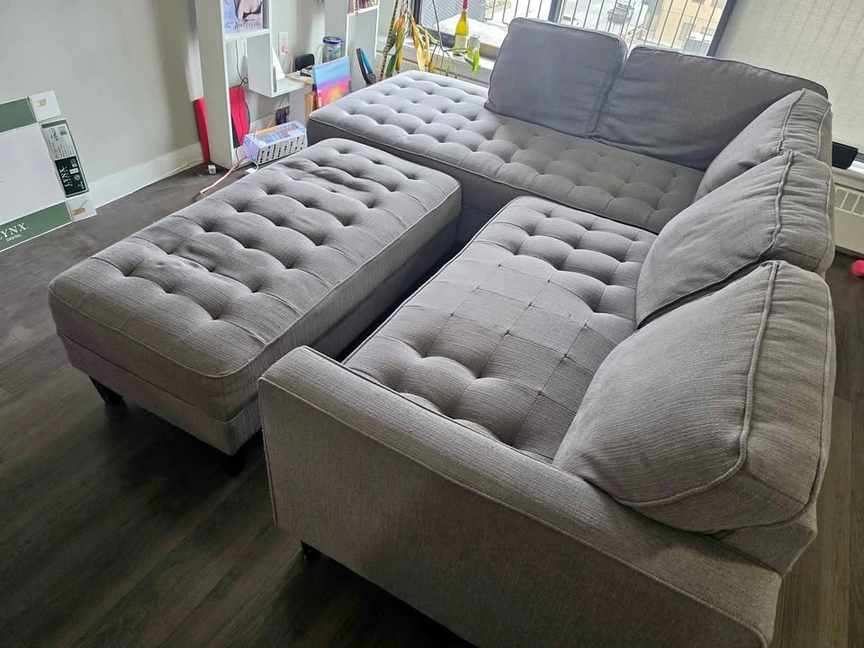 Grey sectional with ottoman