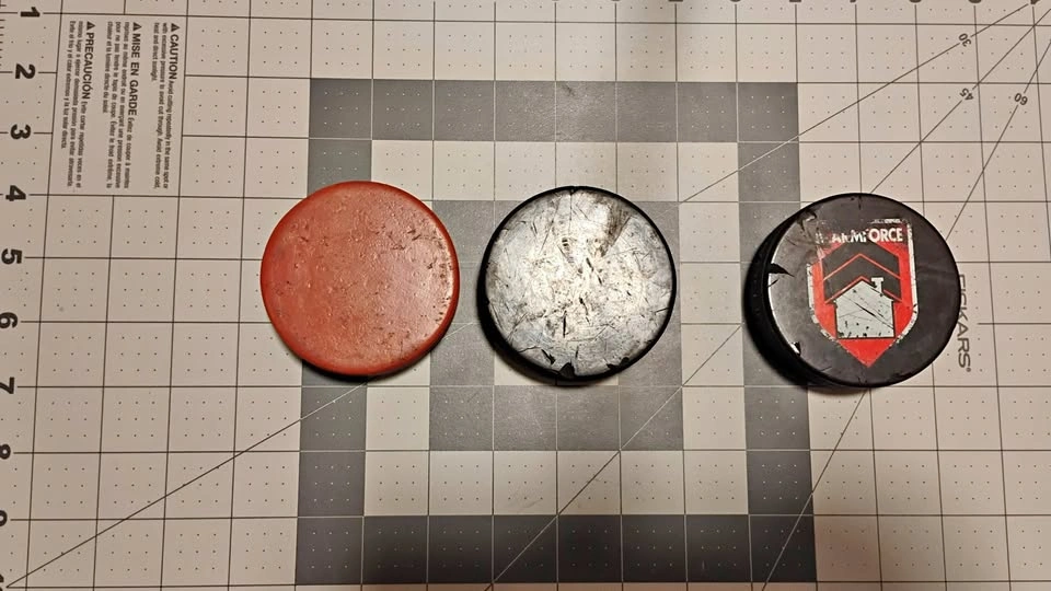 Weighted Hockey Puck and 2 Regulation Hockey Pucks