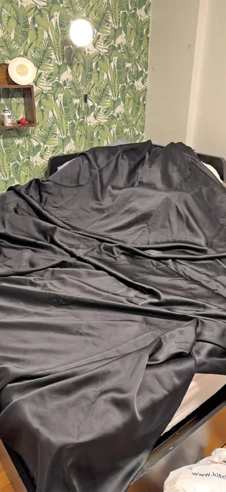 Black shiny fabric, a bit larger than 9x9 feet