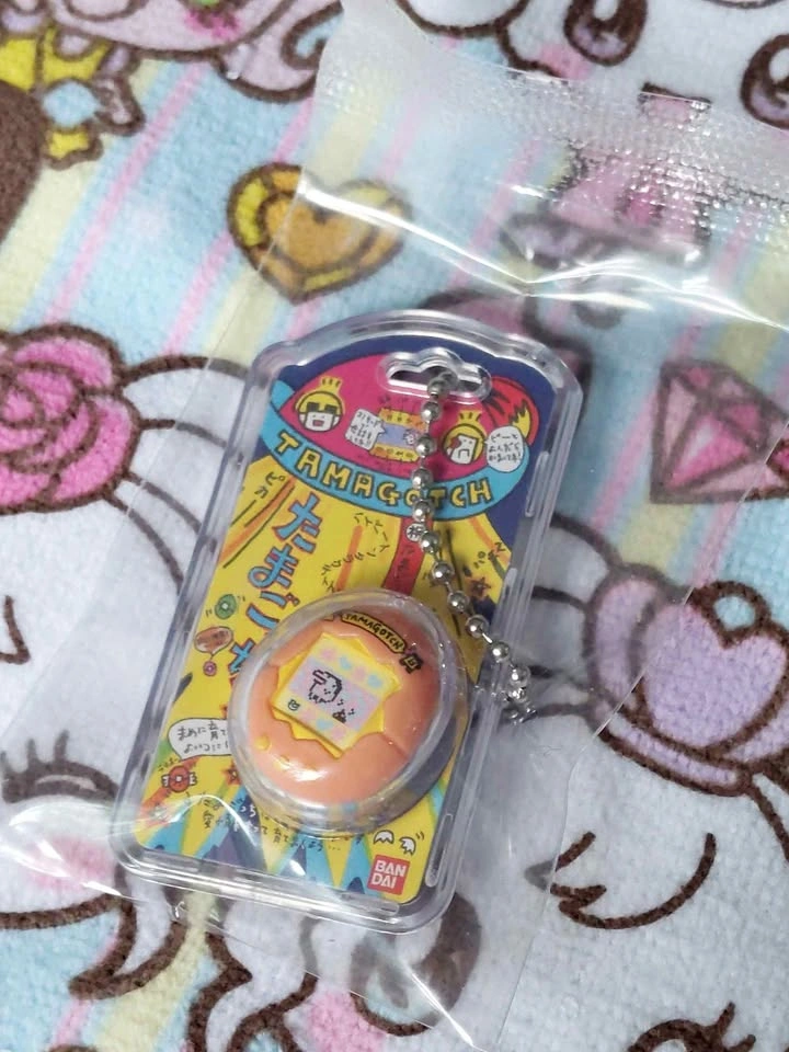 🏈 Tamagotchi Shokugan Mini Keychain Wave 1 Blind Box - Orange