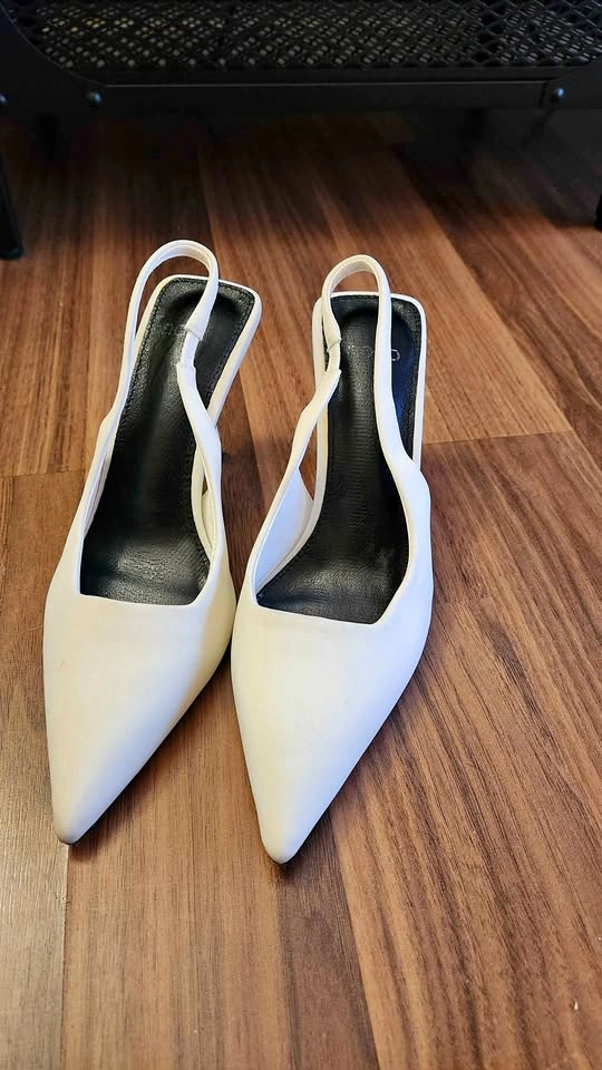 White pointed toe heels