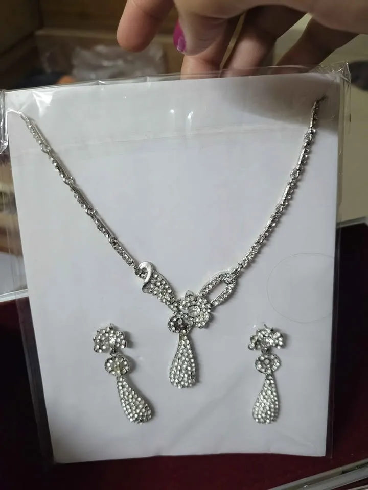 2 neck pieces, each with a pair of earrings image indicator(2)