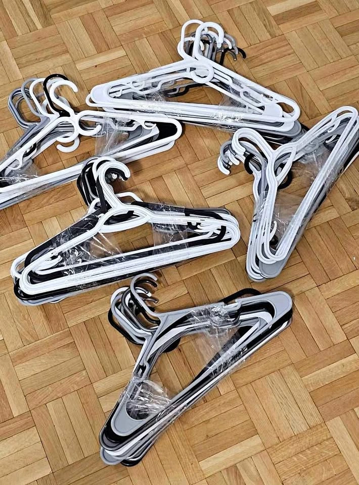 Assorted Plastic, Wire, and Wooden Clothing Hangers
