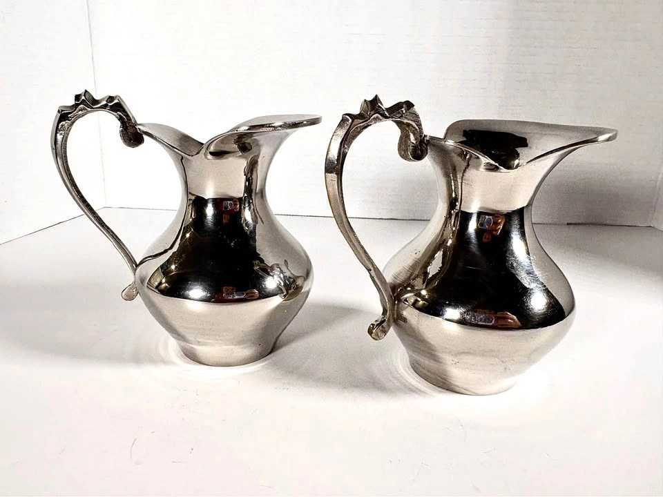 Pair of Decorative Silver Pitchers
