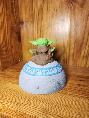 Grogu meditating, AKA Baby Yoda, The Child sitting on Jedi Stone