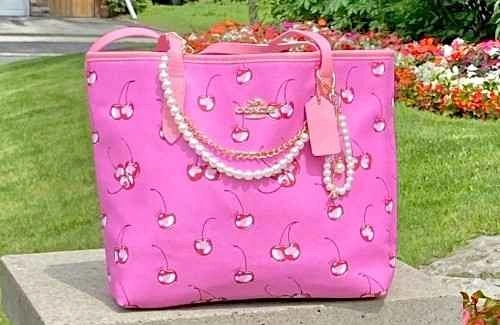 Coach vibrant pink cherry print tote bag
