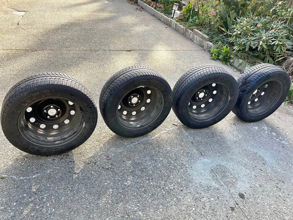 Michelin X-Ice Snow winter tires (235/55R17) on black steel rims