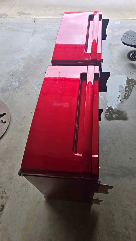 Set of red LG washer and dryer stands