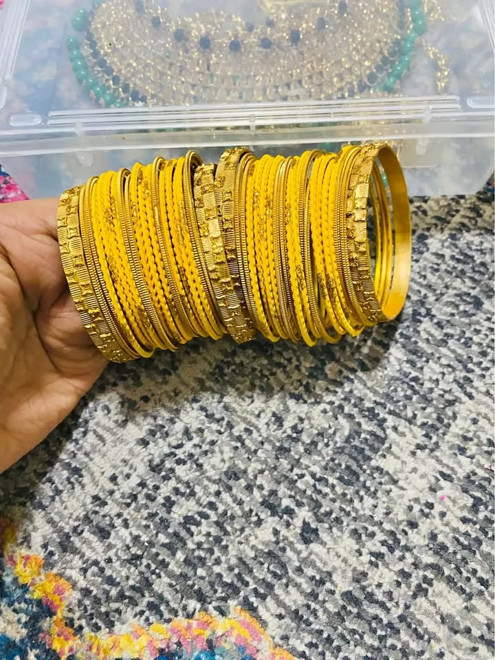 Beautiful 😍 yellow and gold bangles set of 42 thumbnail