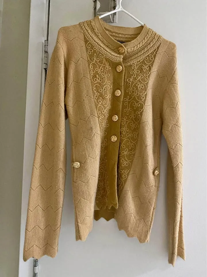 Women warm sweater with golden button details thumbnail