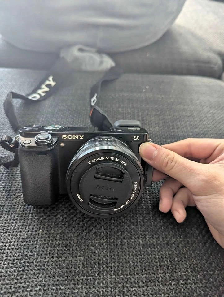 Sony a6000 body + 16-50mm lens + 2 batteries + charger + tripod