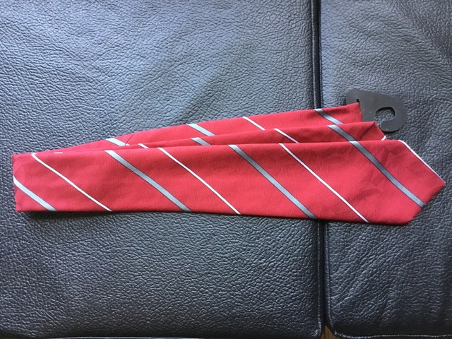 red necktie with grey and white stripes