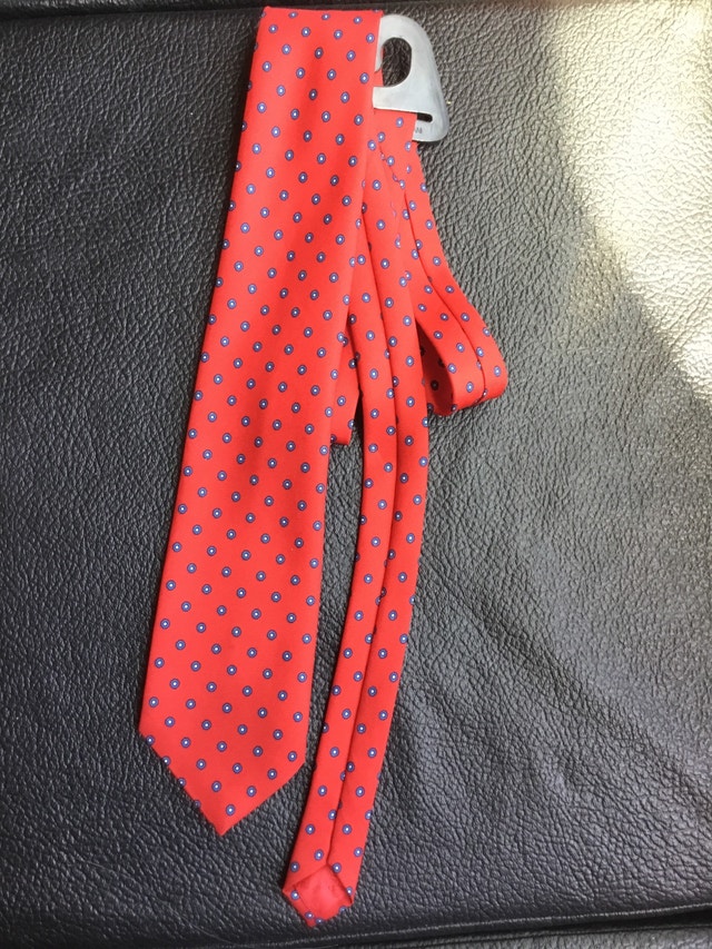 red necktie with blue and white dot design