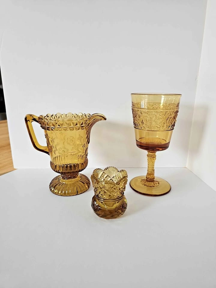 Antique group of amber pressed glass