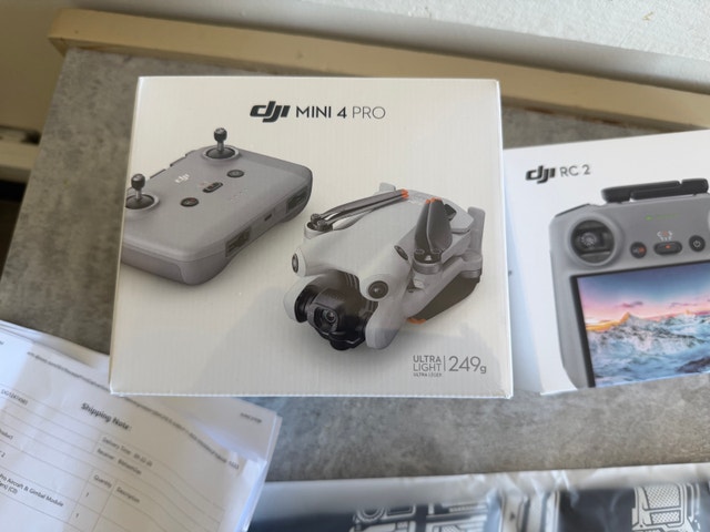 Brand new unopened DJI mini 4 pro w/ RC-2, 2 batteries, charger