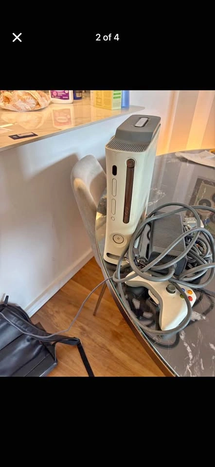 Xbox 360 with cables, controllers, and a game, tested working