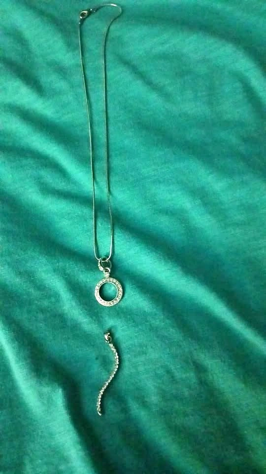 Silver plated necklace with round and curved pendants