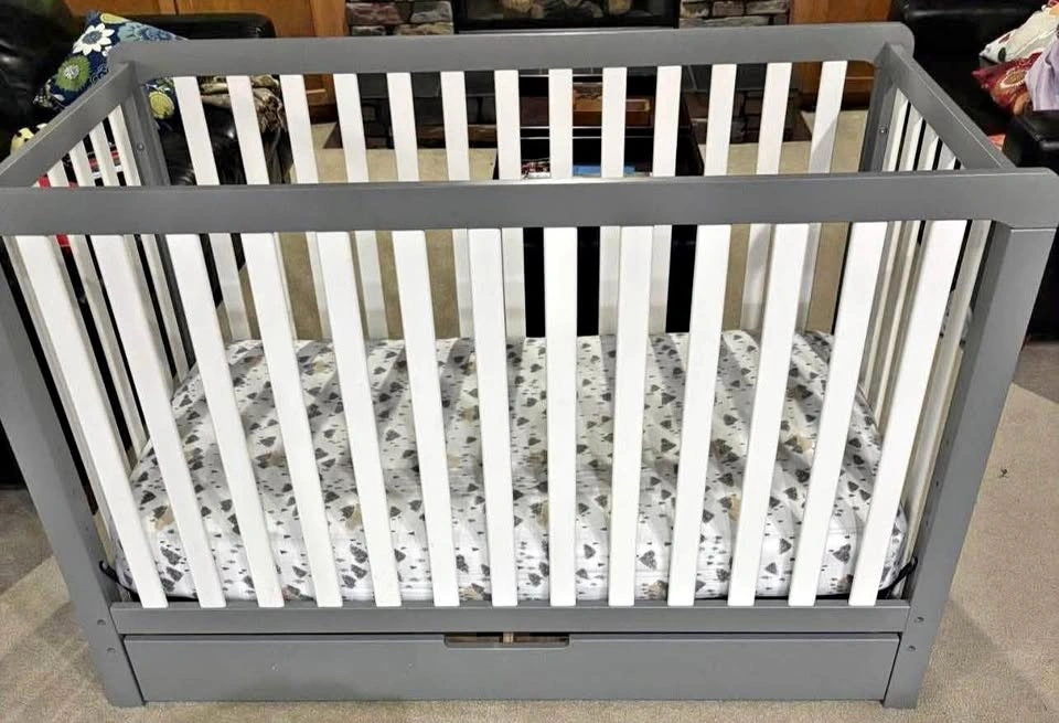 Gray and White Baby Crib with Storage Drawer