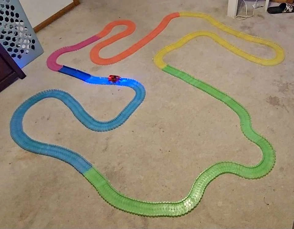 Multiple Glow-In-The-Dark Magic Tracks Race Car Sets