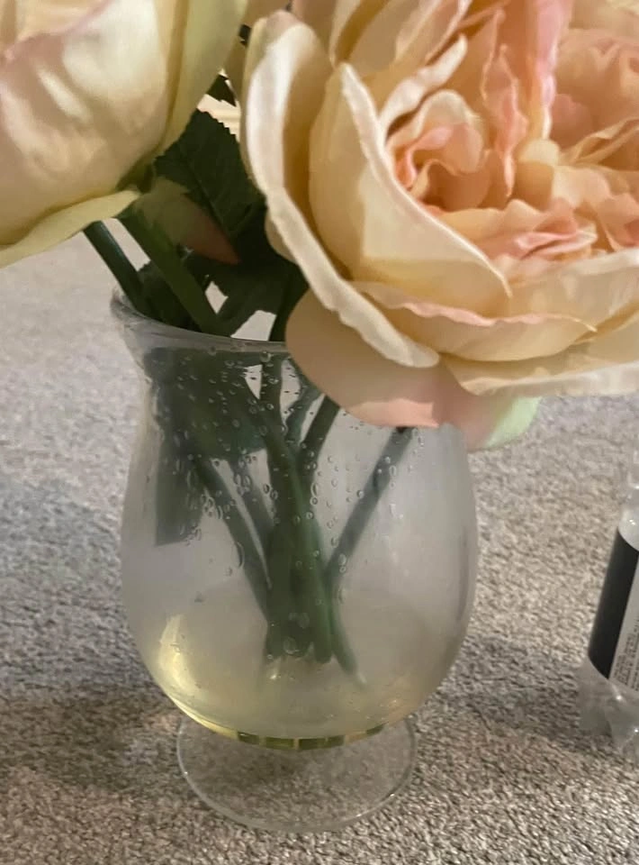 Beautiful fake roses in glass vase (water bottle for scale) - photo 3