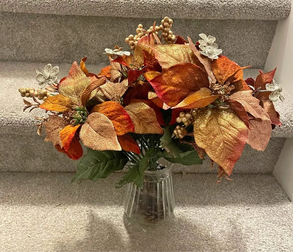 Beautiful fake poinsettias in vase