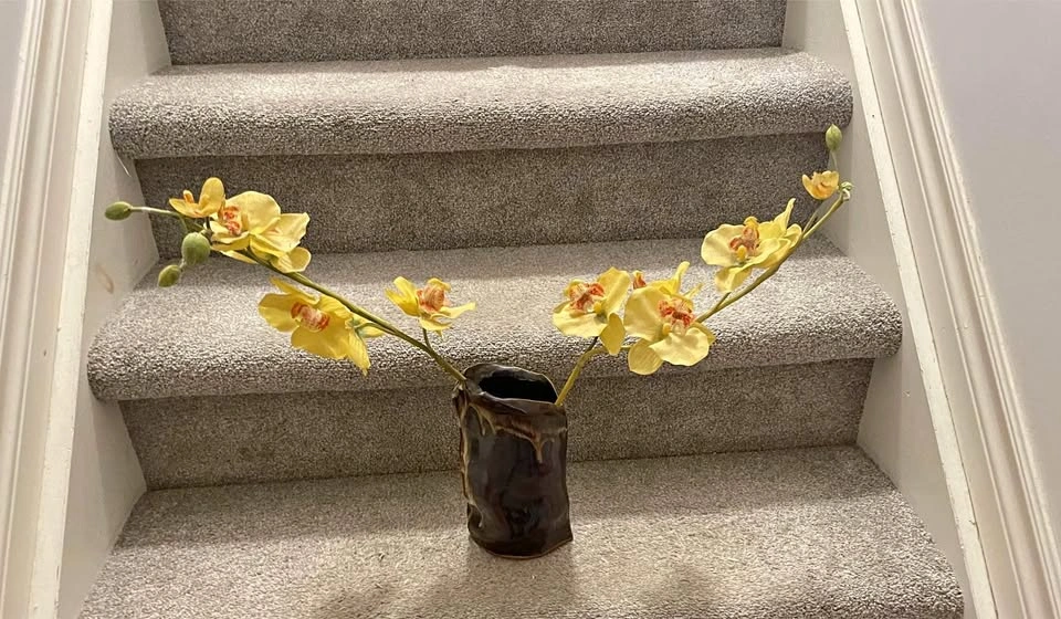 Fake orchid in beautiful vase