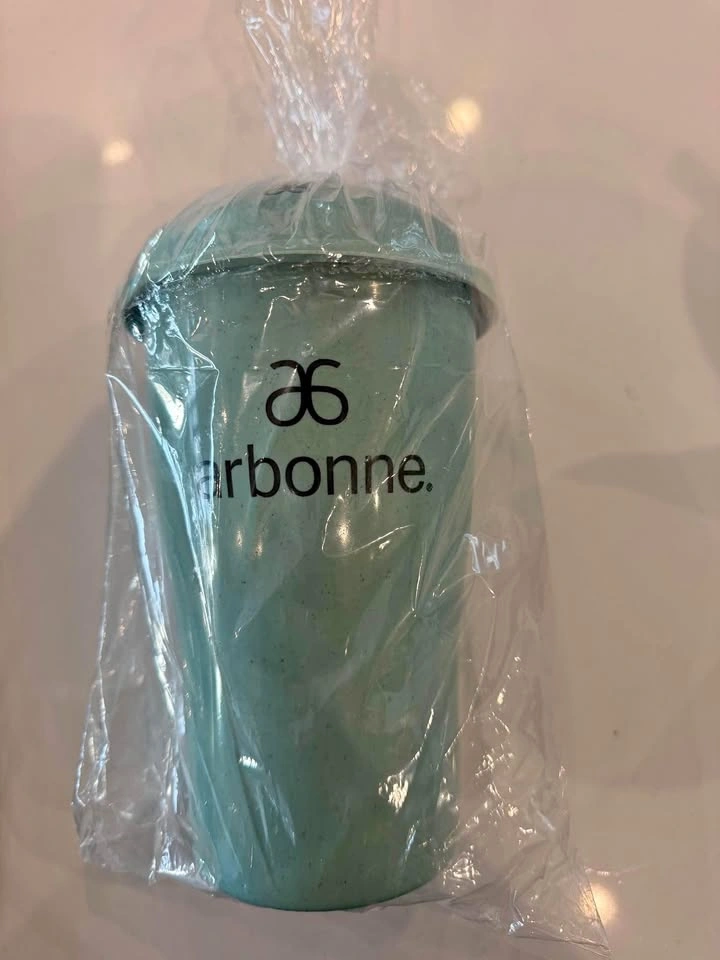 Salad glass on the go with fork and dressing container