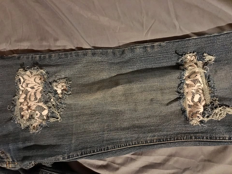 Distressed lace jeans