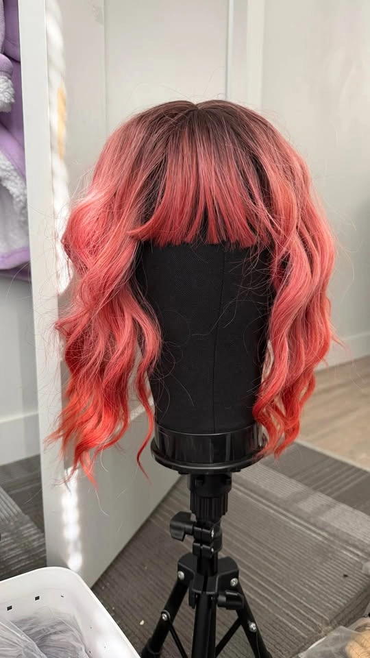 Coral ombre wavy wig bob with bangs