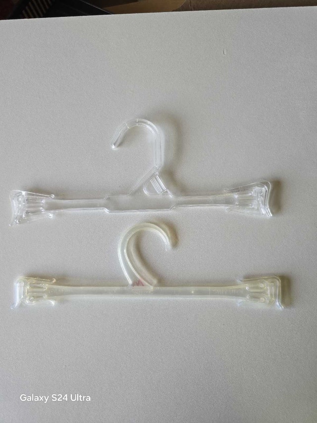 75 small clear plastic hangers