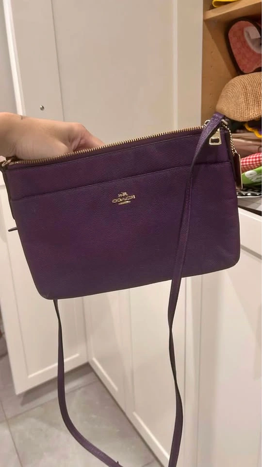 Purple vintage but new coach purse. Great condition