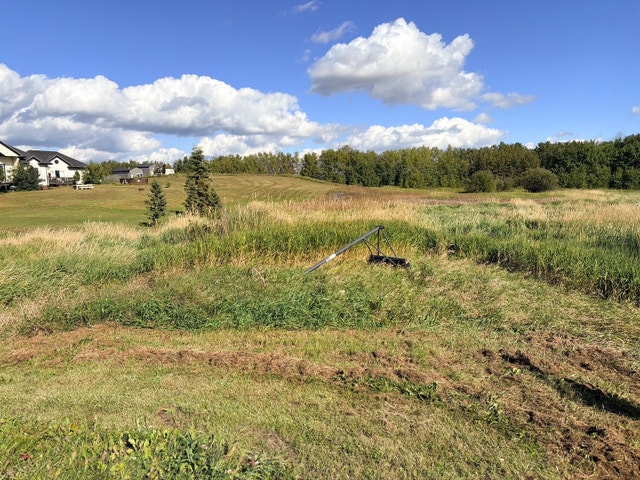 3.28 Acre Lot in Beautiful Neighborhood Across from Pond - photo 2