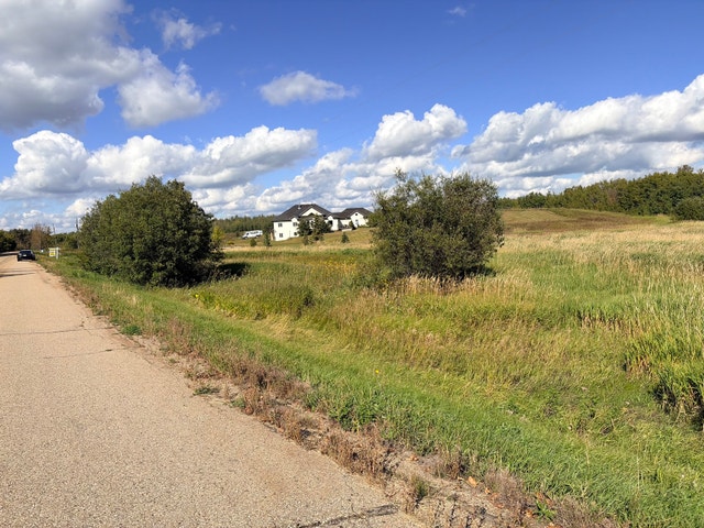 3.28 Acre Lot in Beautiful Neighborhood Across from Pond - photo 4