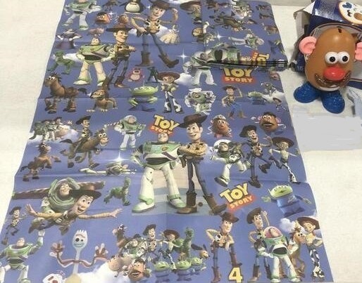 Mr. Potato Head and 5 Pieces of Toy Story Wrapping Paper
