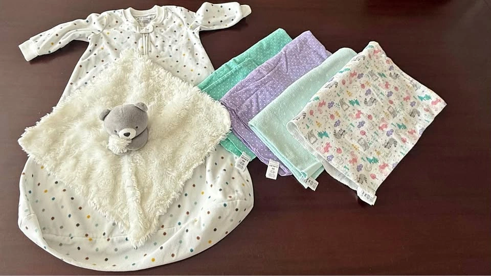 Carter’s baby sleep sack, blankets, and plushy