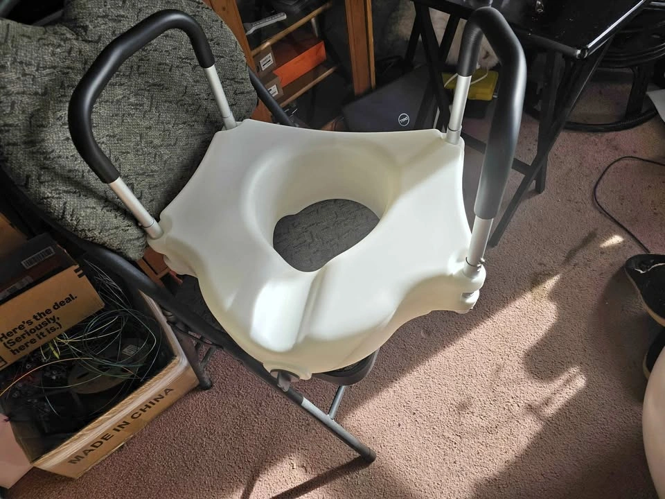 Raised toilet seat