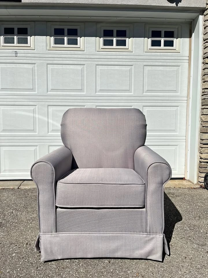 Grey upholstered wingback glider/rocking chair