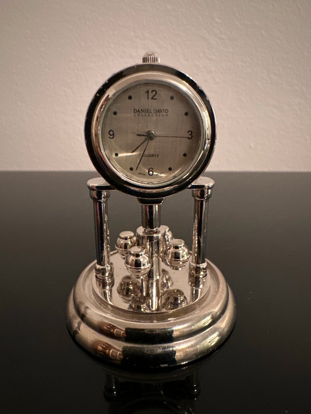 Miniature silver-toned Daniel David quartz mantel or desk clock