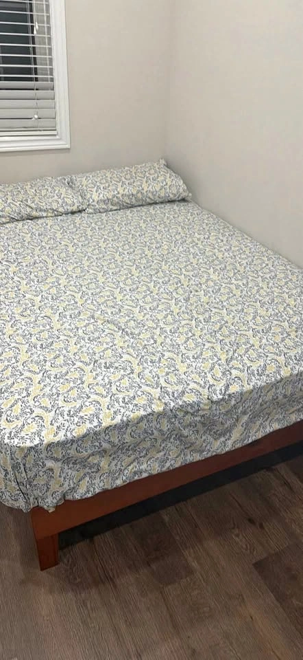 Wooden bed frame with mattress