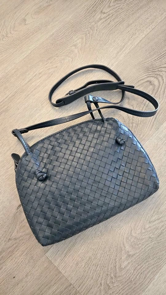 Blue woven crossbody bag