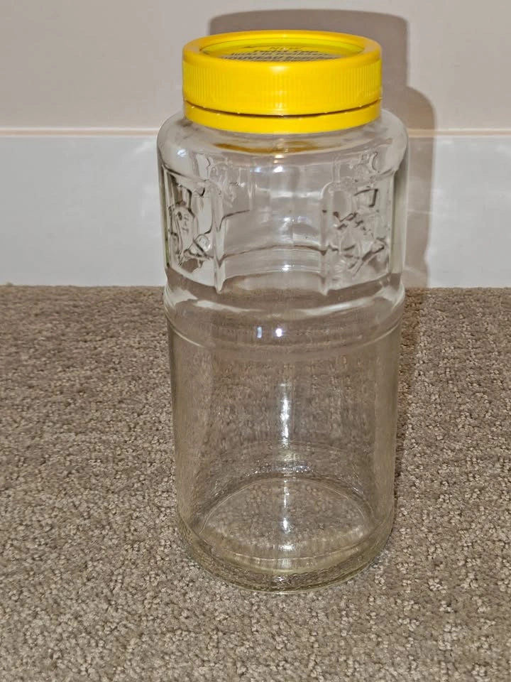 Vintage Planters Peanuts Glass Jar with Yellow Twist Lid