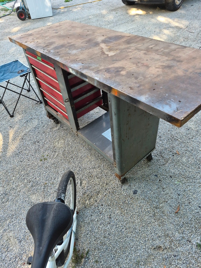 wood work table with red tool box, rolling