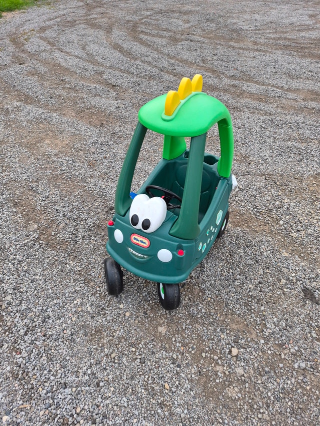 A Little Tikes Dino Cozy Coupe children’s ride‑on toy